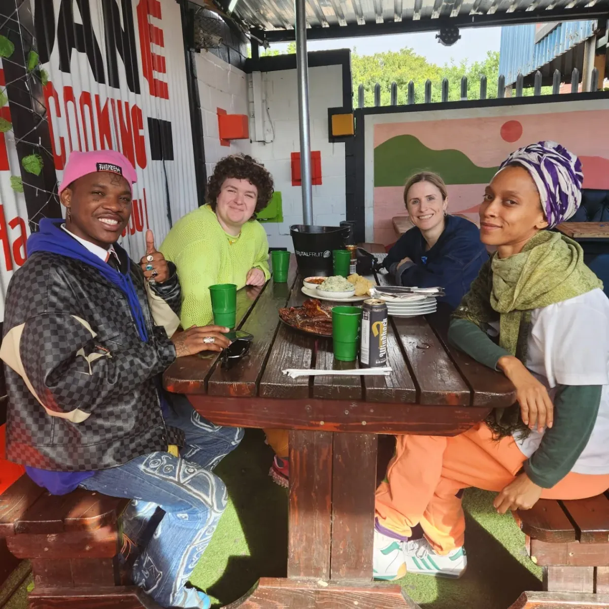 Tour group around a table of food at Jordan Ways of Cooking