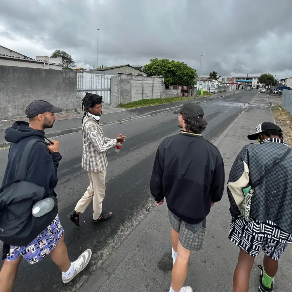 Guide and guests walking down a Langa street