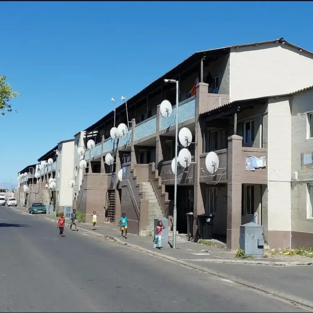 A Langa street lined with flats and satellite dishes