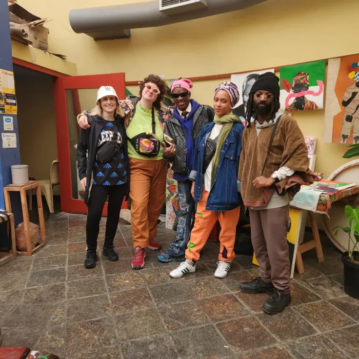 Tour group photographed together in the Guga S'thebe courtyard